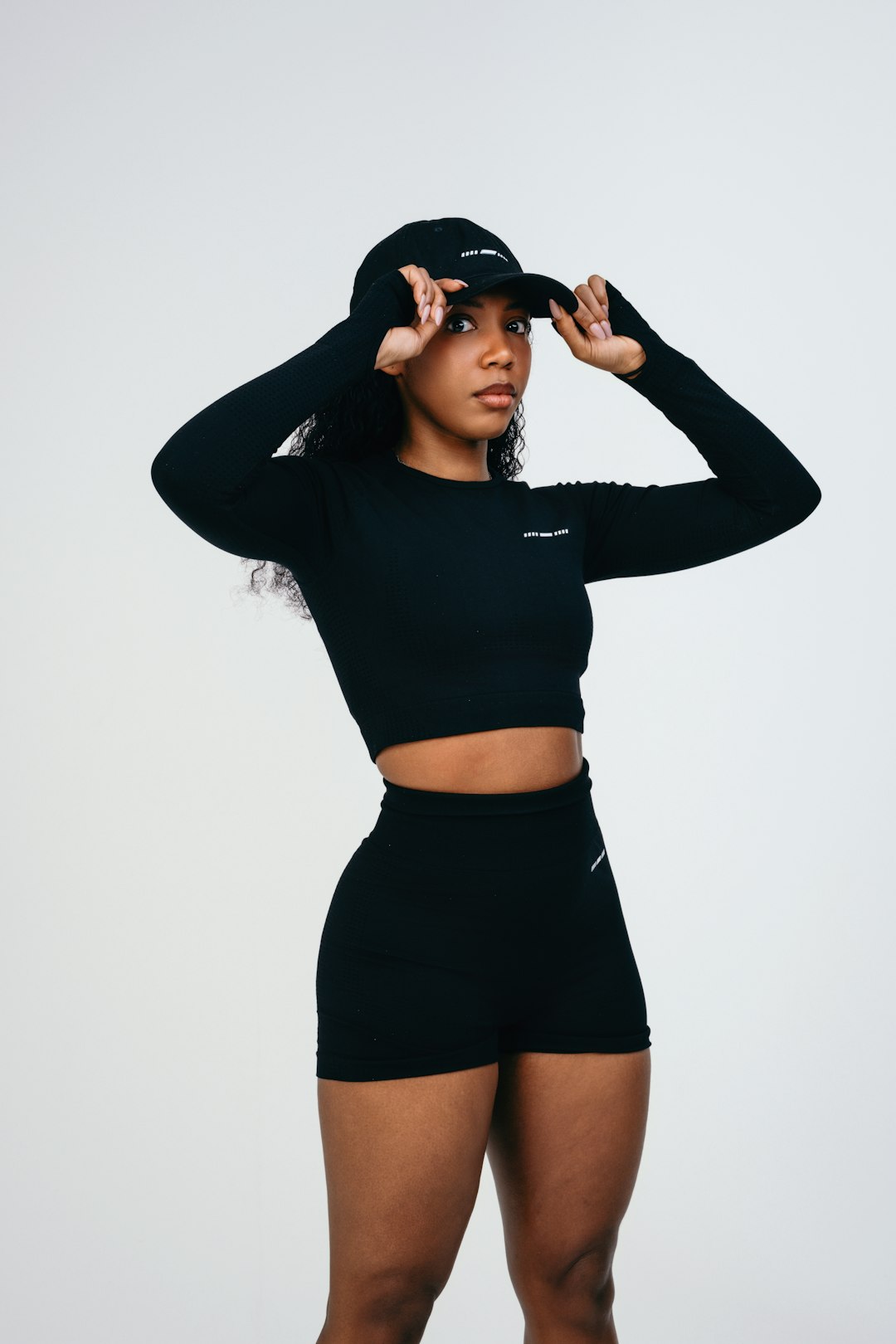 a-woman-in-a-black-top-and-shorts-seqidgq0quk