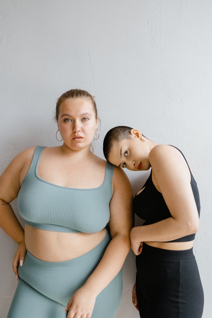 Two diverse women confidently pose in trendy co-ord sets, celebrating body positivity.